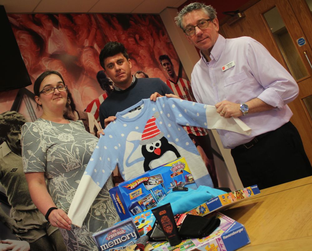 Gary Hutchinson with Salvation Army’s Craig Hilton and Sonia Ritchie.