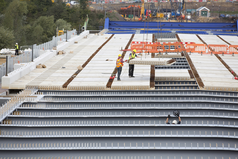 Coming together: The concrete panels are installed onto the first section of bridge deck.