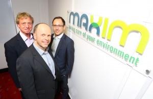 David Thomas of NEL with (back, from left) Graham Conway and Michael Hall of Maxim FM