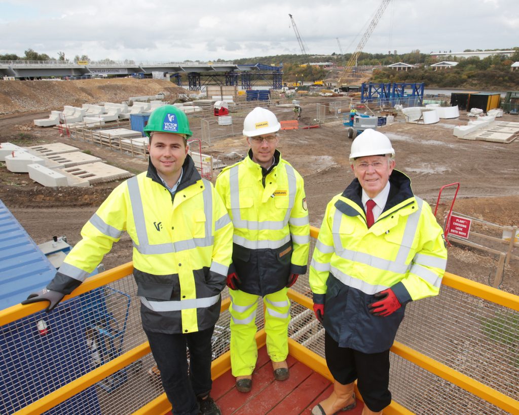 Patrick Van Severen, Project Director for Victor Buyck Steel Construction, left, is pictured with Cllr Harry Trueman, Deputy Leader of Sunderland City Council, centre, and Stephen McCaffrey, Project Director for FVB Joint Venture, with the moving bridge deck in the background.