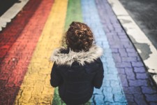 Child-with-rainbow-painted-on-pavement